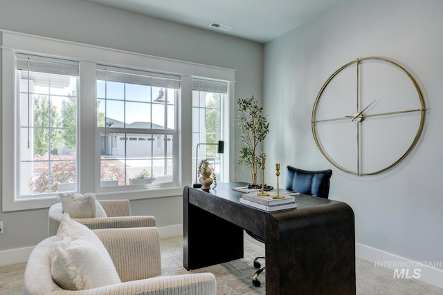 carpeted office with baseboards