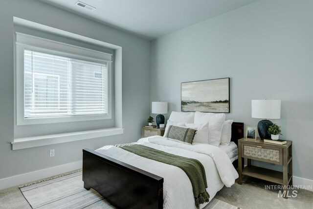 bedroom featuring baseboards