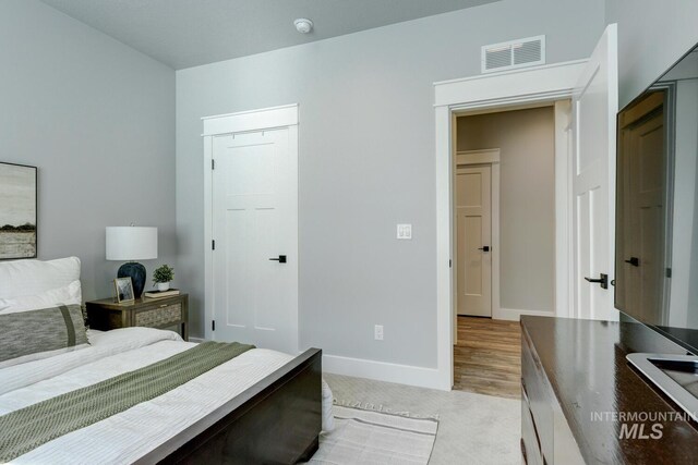 bedroom featuring a closet and baseboards