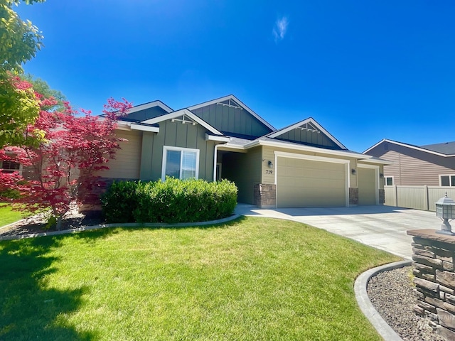 719 W Arbor Pointe, Nampa, ID 83686 - view of front of home with board and batten siding, an attached garage, driveway, and stone siding