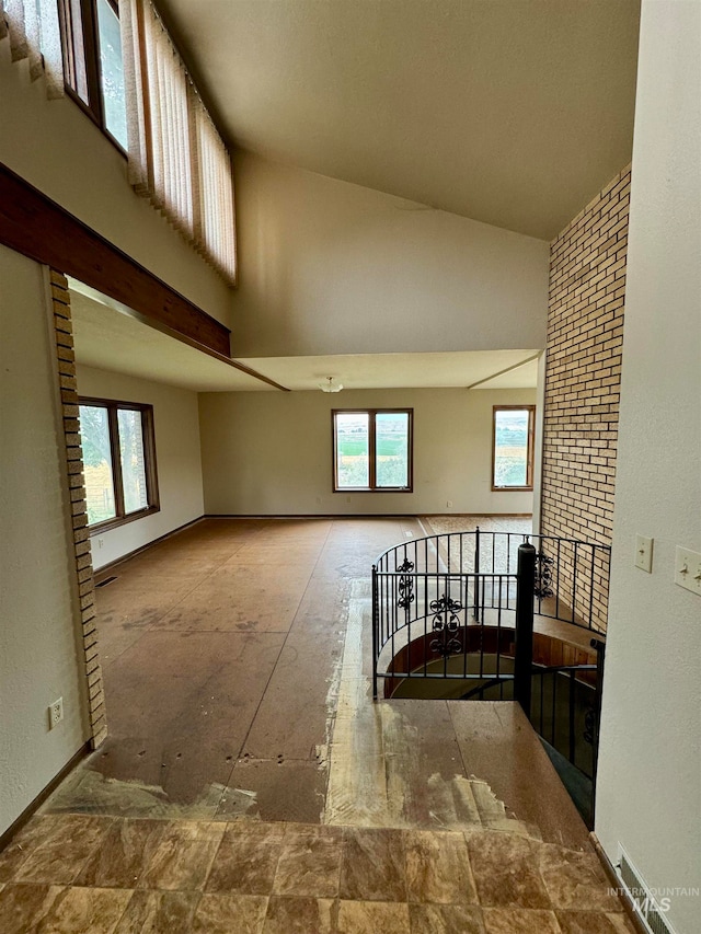 interior space featuring high vaulted ceiling and a wealth of natural light