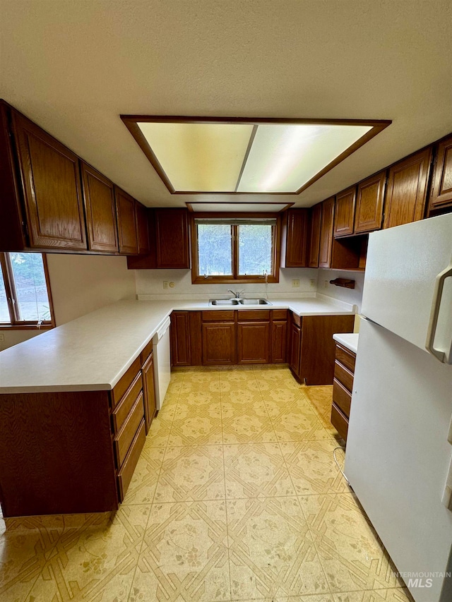 kitchen with white appliances and sink