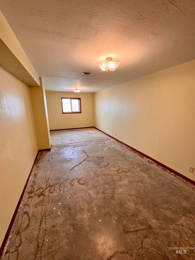 basement with a textured ceiling