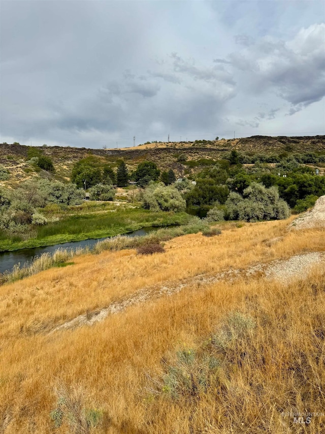 view of landscape with a water view