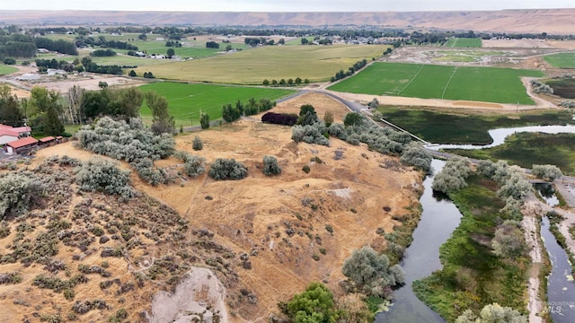 aerial view with a water view and a rural view