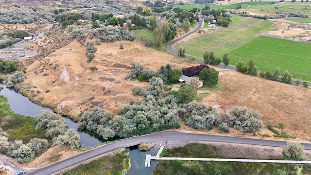 aerial view featuring a rural view and a water view