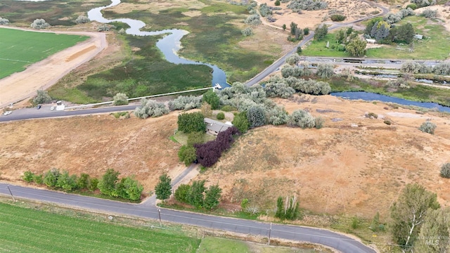 drone / aerial view featuring a water view and a rural view