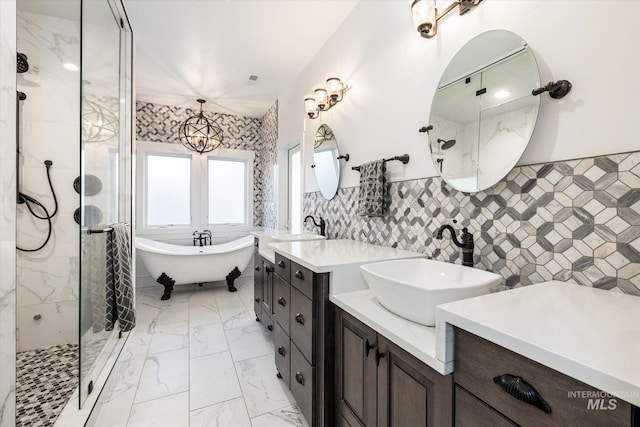 bathroom with tile walls, plus walk in shower, vanity, and an inviting chandelier