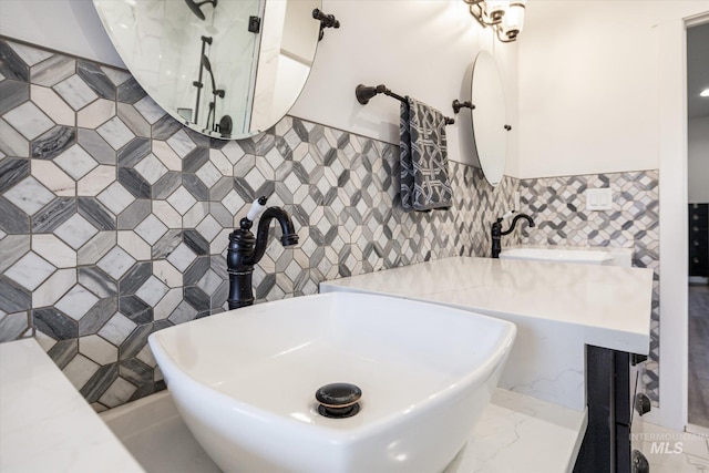 bathroom with tile walls and sink