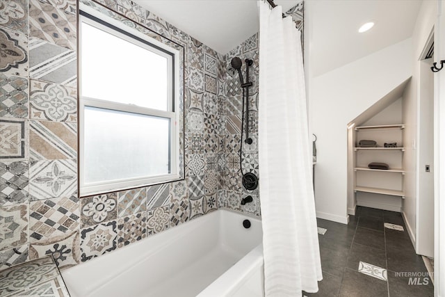 bathroom with tile patterned flooring and shower / bath combination with curtain