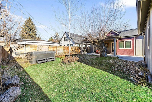 view of yard featuring a patio area and a hot tub