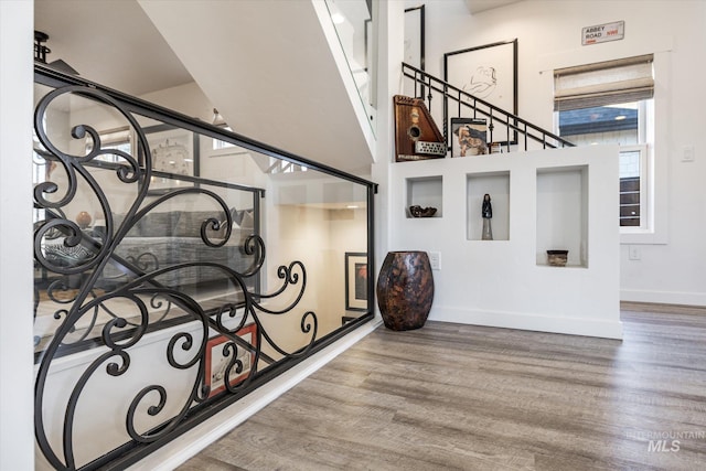 stairway featuring hardwood / wood-style floors