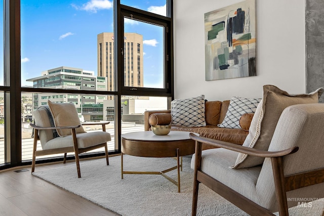 851 W Front St Unit 607, Boise, ID 83702 - living room featuring healthy amount of natural light, wood finished floors, and expansive windows