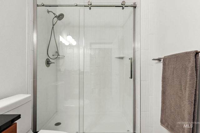 851 W Front St Unit 607, Boise, ID 83702 - full bathroom featuring a shower stall, toilet, and vanity