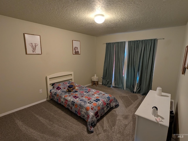 carpeted bedroom featuring a textured ceiling