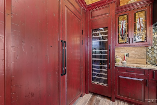 14051 Deerfield Rd, Mccall, ID 83638 - bar featuring light wood-style flooring and wooden walls