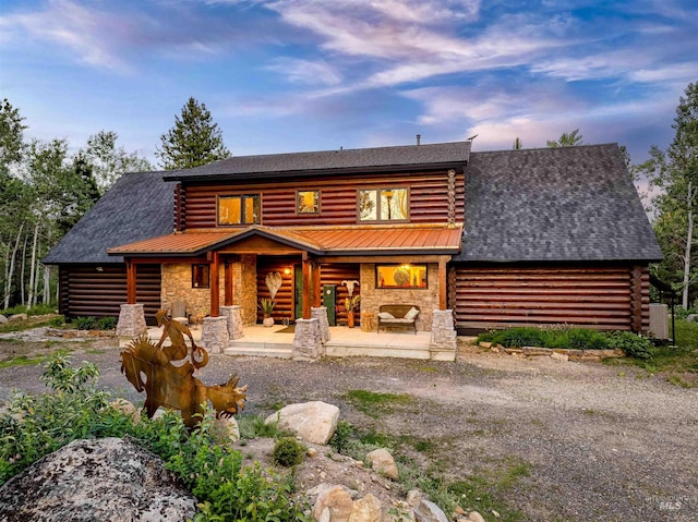 14051 Deerfield Rd, Mccall, ID 83638 - view of front of property featuring log siding, stone siding, and a porch