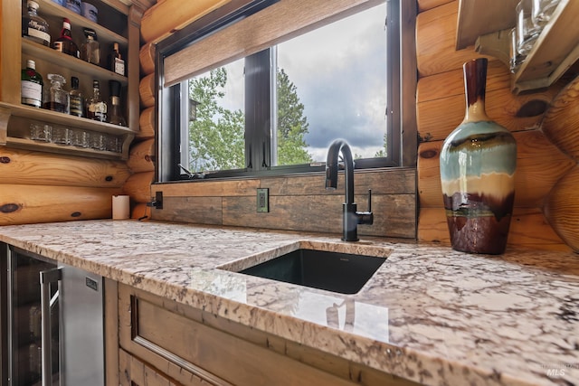 14051 Deerfield Rd, Mccall, ID 83638 - kitchen with healthy amount of natural light, light stone countertops, decorative backsplash, and rustic walls