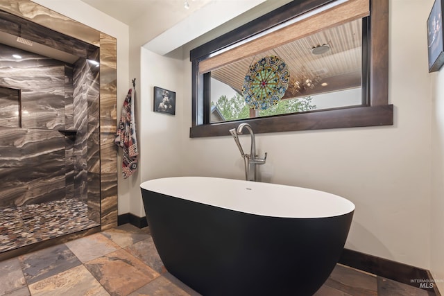 14051 Deerfield Rd, Mccall, ID 83638 - full bath with a freestanding bath, stone tile flooring, and walk in shower