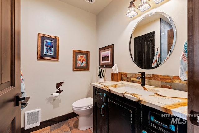 14051 Deerfield Rd, Mccall, ID 83638 - bathroom featuring vanity, stone tile floors, and heating unit
