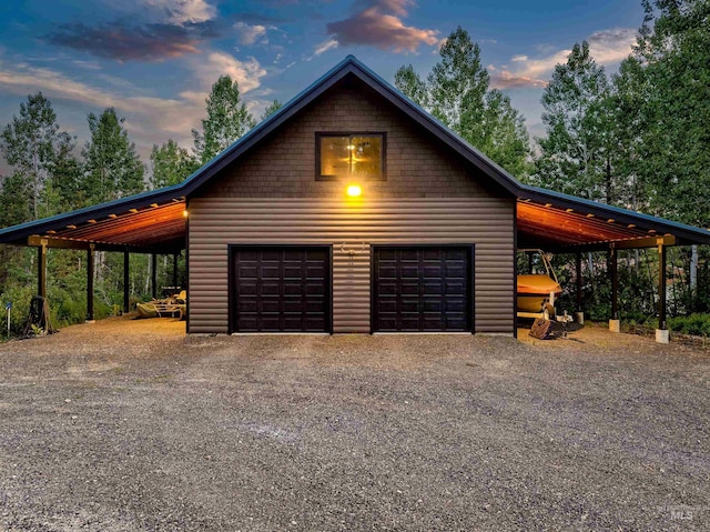 14051 Deerfield Rd, Mccall, ID 83638 - garage at dusk with a detached garage and driveway