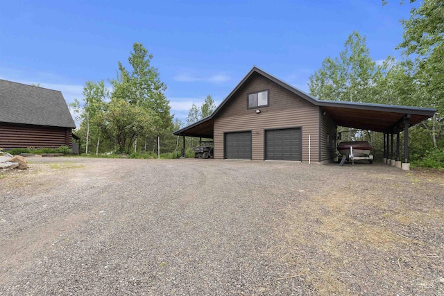 14051 Deerfield Rd, Mccall, ID 83638 - view of property exterior with a garage, an outbuilding, and driveway