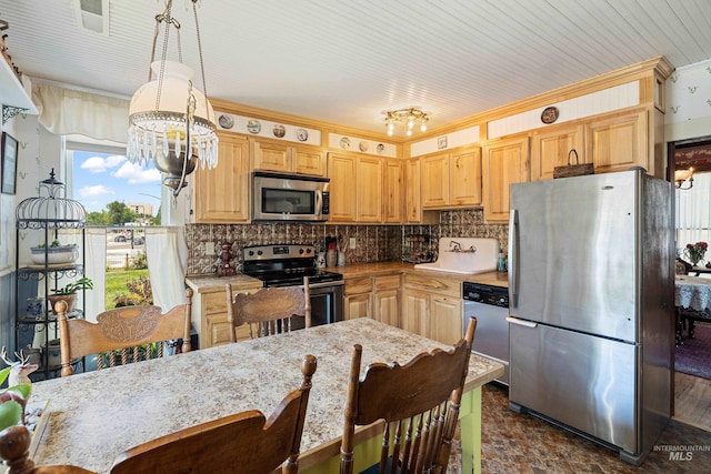 kitchen with crown molding, decorative light fixtures, an inviting chandelier, appliances with stainless steel finishes, and light brown cabinets