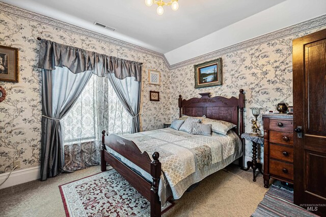 bedroom with light colored carpet