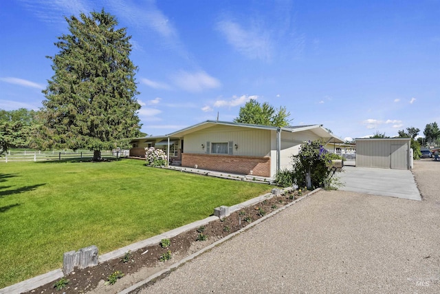 93 S Lancaster Dr, Nampa, ID 83651 - view of front facade with brick siding, driveway, and an outbuilding