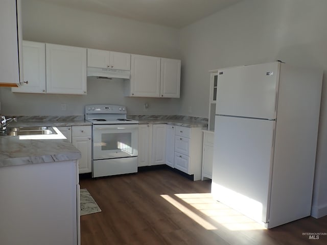 kitchen featuring dark wood-type flooring, sink, white appliances, and white cabinetry