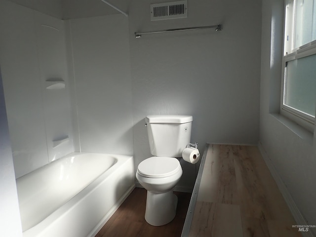 bathroom featuring hardwood / wood-style floors and toilet