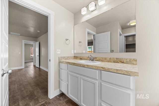 4991 N Sun Shimmer Ave, Meridian, ID 83646 - bathroom featuring vanity and baseboards