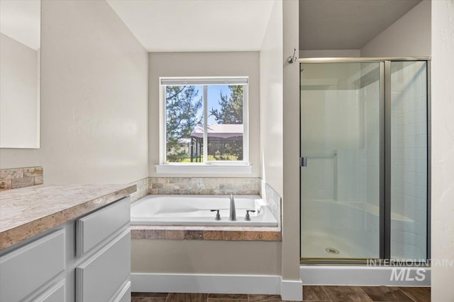 4991 N Sun Shimmer Ave, Meridian, ID 83646 - full bathroom featuring a shower stall, a bath, and vanity