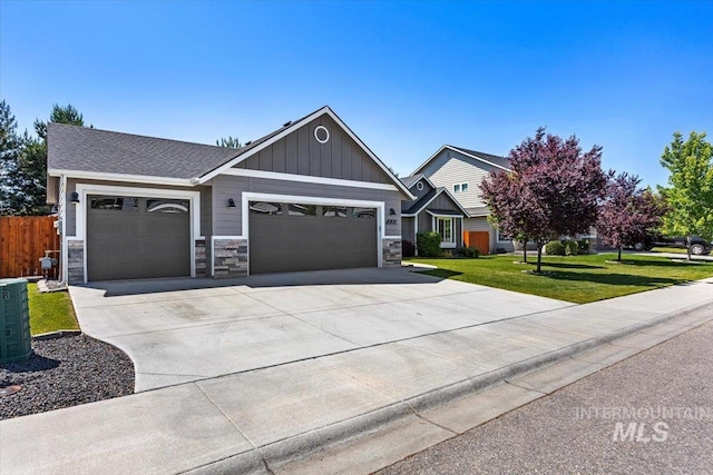 4991 N Sun Shimmer Ave, Meridian, ID 83646 - craftsman inspired home with an attached garage, board and batten siding, stone siding, and driveway