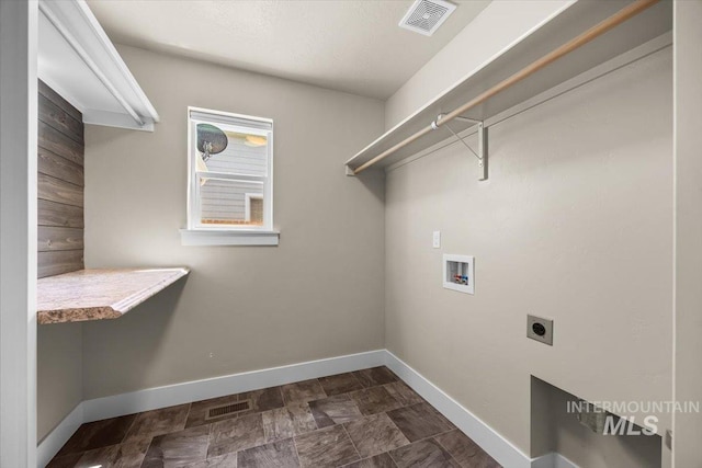 4991 N Sun Shimmer Ave, Meridian, ID 83646 - laundry room featuring electric dryer hookup, hookup for a washing machine, and baseboards