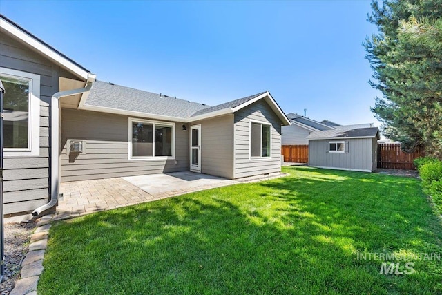 4991 N Sun Shimmer Ave, Meridian, ID 83646 - rear view of property with a patio area and a shingled roof