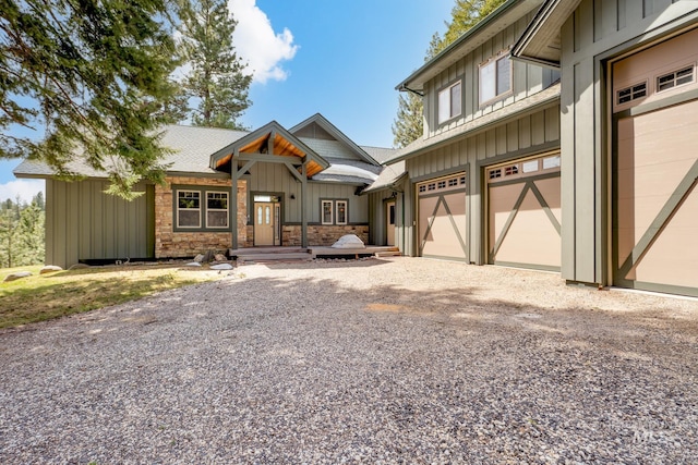 165 Stillwater Ct, Mccall, ID 83638 - view of front of property featuring board and batten siding, gravel driveway, and an attached garage
