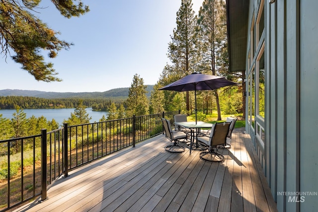 165 Stillwater Ct, Mccall, ID 83638 - wooden terrace featuring a water and mountain view, a forest view, and outdoor dining area