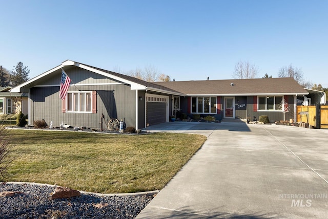 single story home featuring a garage and a front yard