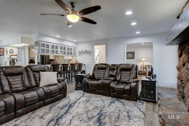 living room featuring ceiling fan