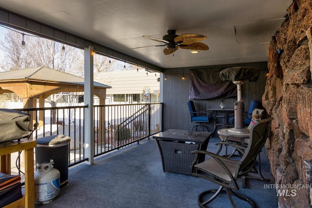 view of patio / terrace featuring ceiling fan and a balcony