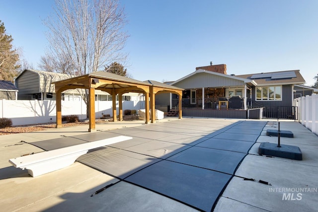 exterior space featuring a patio and a gazebo