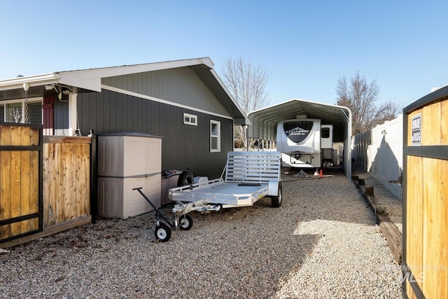 view of home's exterior featuring a carport