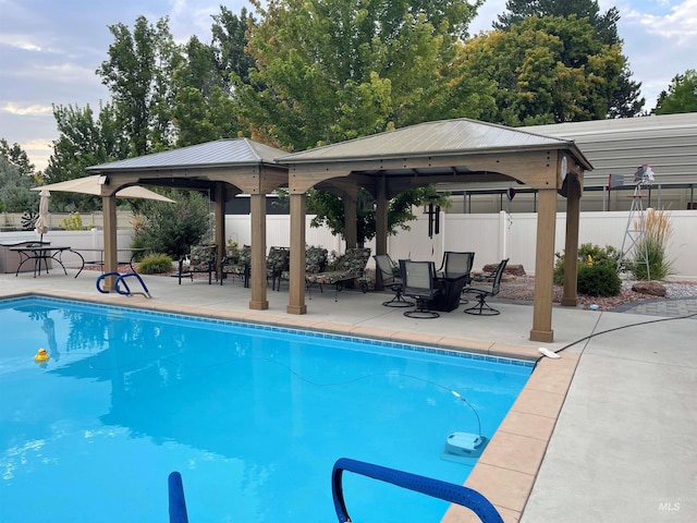 view of pool featuring a gazebo and a patio area