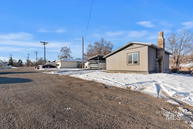 ranch-style house with a carport