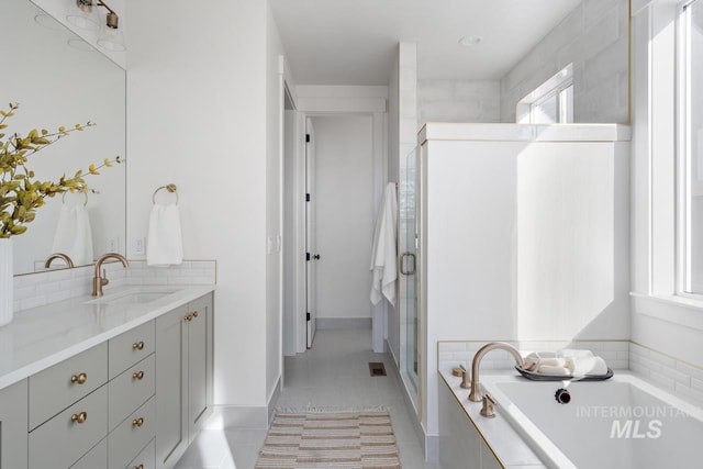 bathroom with vanity, separate shower and tub, and tile patterned flooring