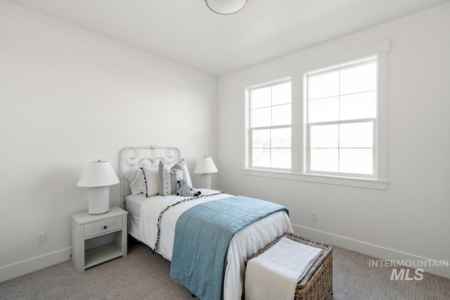 bedroom with carpet flooring and baseboards