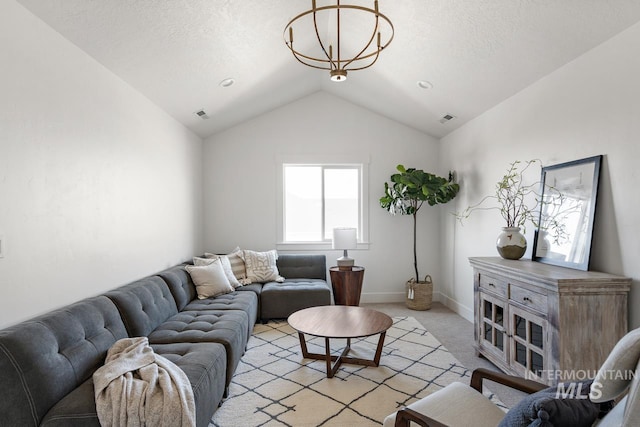 carpeted living room featuring a textured ceiling, lofted ceiling, and a chandelier