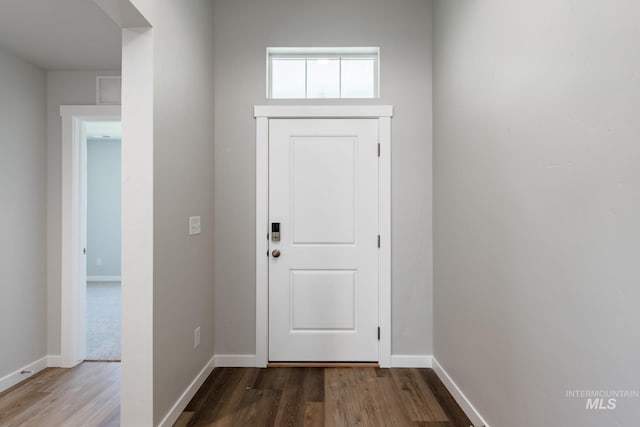 entryway featuring wood finished floors and baseboards