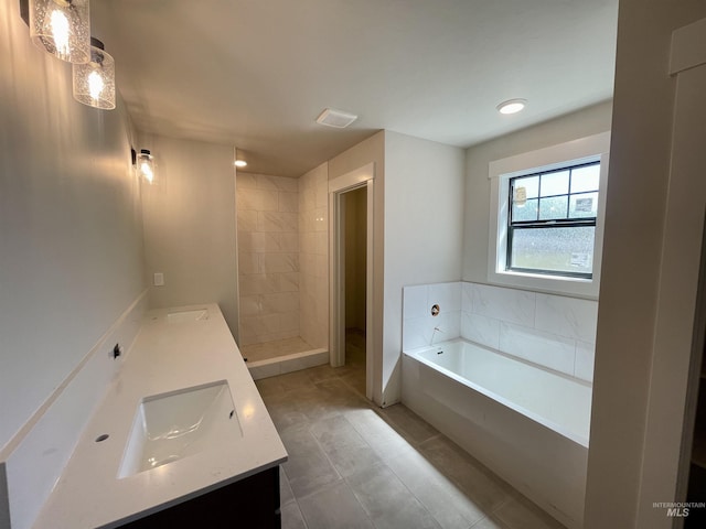 1640 E Cutgrass Ln, Eagle, ID 83616 - bathroom with vanity, a garden tub, a stall shower, and tile patterned flooring